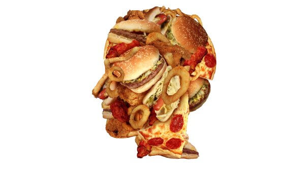 A composition of various fast foods, including burgers, pizza, fried chicken, and onion rings, arranged in the shape of a human brain on a white background.